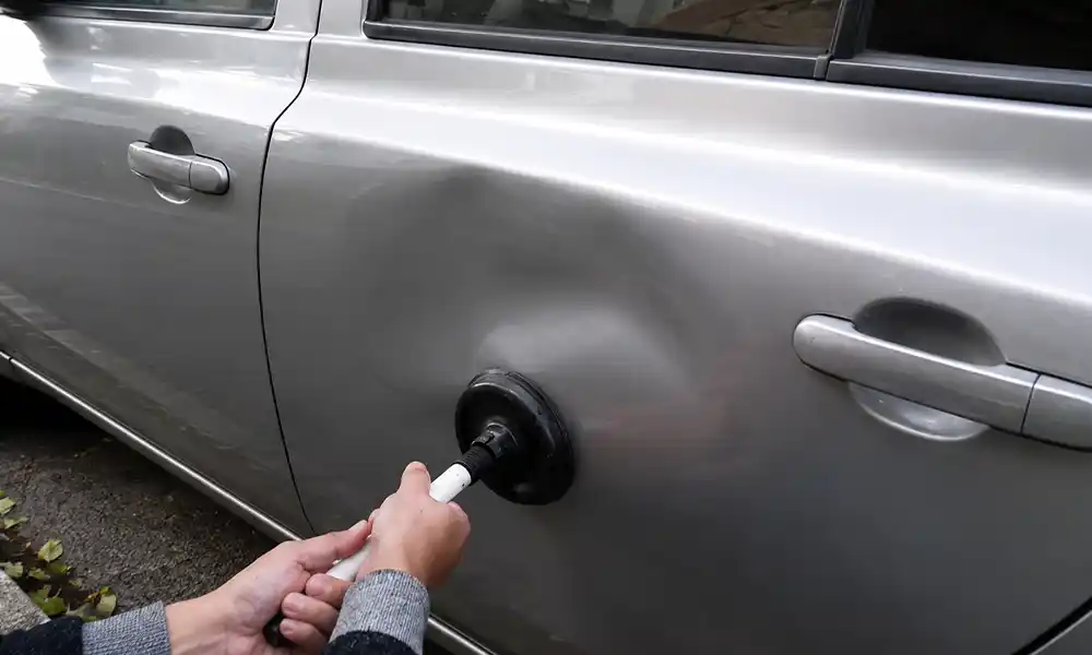 Plunger suction DIY dent removal on flat car panel